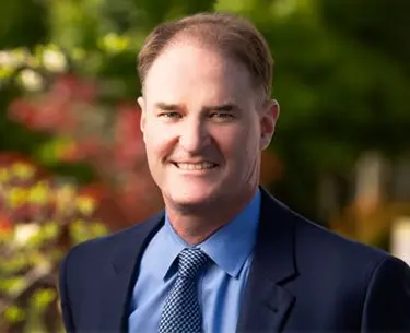 Ben Crocker Personal Injury Attorney smiling outside of his office in downtown Bowling Green, KY