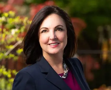 Cyndi Crocker Personal Injury Attorney smiling outside of her office in downtown Bowling Green, KY