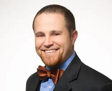 Josephy McReynolds Personal Injury Attorney smiling on a white background
