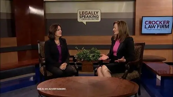 Cyndi Crocker talking with Whitney Scott in WBKO Studios on the set of Legally Speaking