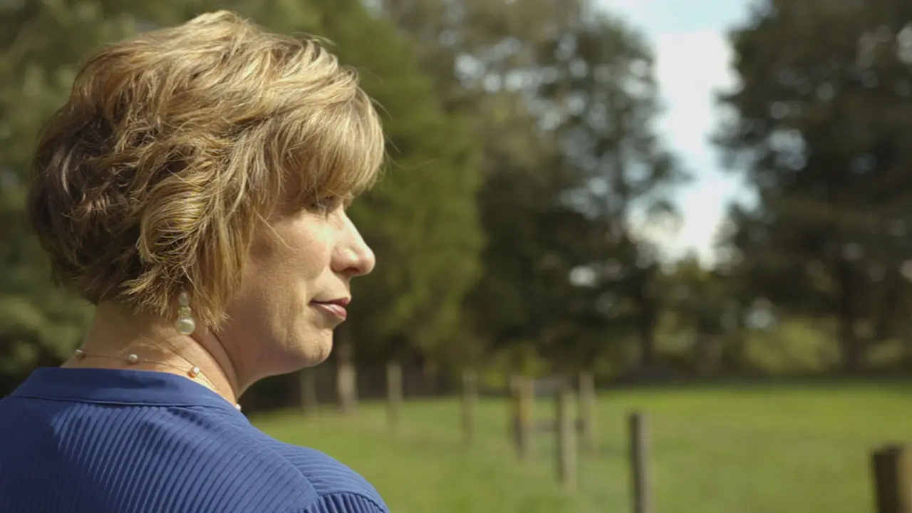 Betty Glenn is looking across a field thinking about her car accident